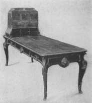 By courtesy of the Metropolitan Museum of Art. Inlaid desk with beautifully chiselled ormolu mounts