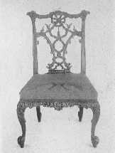 Two important phases of Chippendale's work—an elaborate ribbon-back chair, and one of the more staid Gothic type.