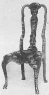 This fine example of a Queen Anne lacquered chair shows the characteristic splat and top curve, the slip seat narrower at the back than front with rounded corners, and cabriole legs.