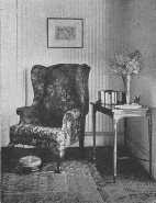 A lamp would be an addition to this corner. The footstool is Victorian and a bit clumsy.