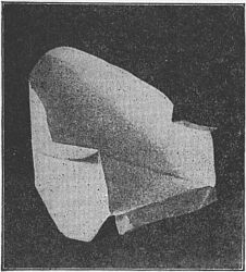 Fig. 94—Make the arm-chair of an oblong envelope.