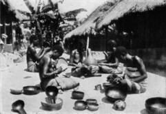 WOMEN MAKING POTTERY