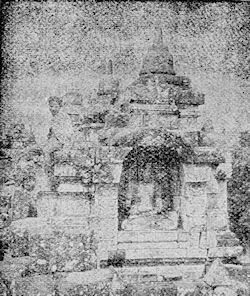 Buddha statue in a niche.