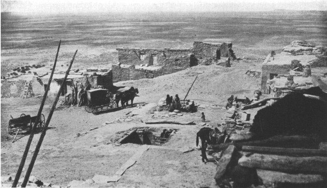 On top of the world—a Moki city on a Mesa in the Painted Desert. At the left are the ends of a ladder leading from an underground council chamber