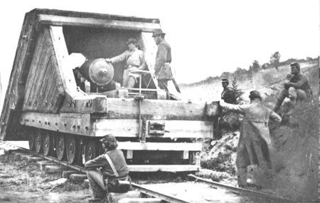 Curious Federal soldiers inspect a Confederate armored gun, the earliest rail artillery on record. This "land ram", designed by Lt. John M. Brooke of the Confederate Navy, was first used at Savage Station, Virginia, in 1862.