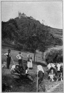 Copyright by Underwood & Underwood, N. Y. CASTLE HOHENZOLLERN Ancestral seat of the Hohenzollern dynasty. The men and women in the foreground are good types of Germany's peasantry.