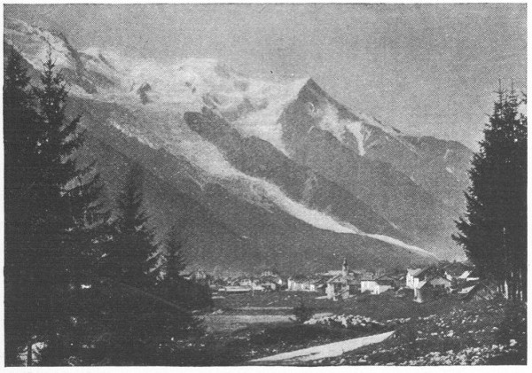 village nestled in a valley in the Alps