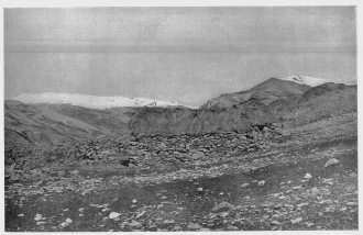 Fig. 24—This stone hut, grass-thatched, is the highest permanent habitation in Peru, and is believed to be the highest in the world. Altitude of 17,100 feet (5,210 m.) determined by instrumental survey. The general geographic relationships of the region in which the hut is situated are shown in Fig. 25. For location see the topographic map, Fig. 204.