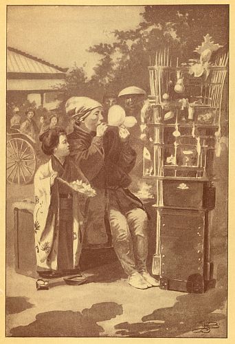 man sitting by candy cart