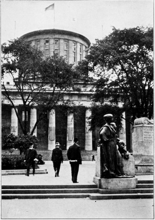 Looking into the State House grounds toward the broad flight of steps before the west front of the building