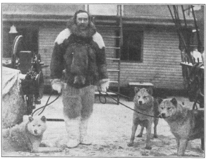 Peary in Arctic dress with his Eskimo dogs  ©1909, Doubleday, Page & Co.