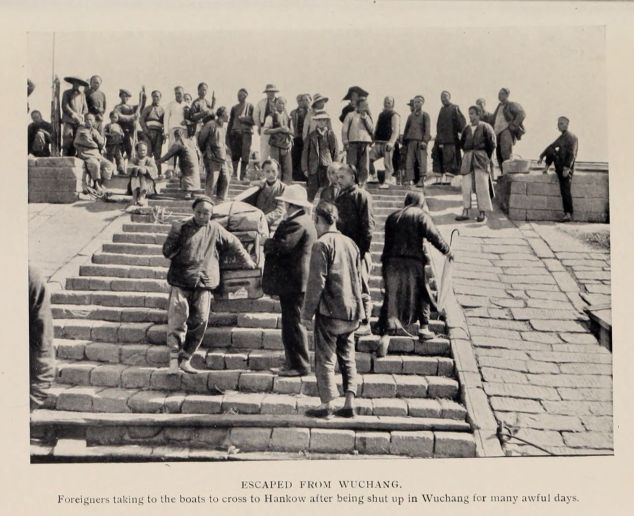 ESCAPED FROM WUCHANG. Foreigners taking to the boats to cross to Hankow after being shut up in Wuchang for many awful days.