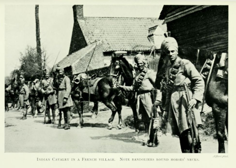 Indian Cavalry in a French village. Note bandoliers round horses’ necks.