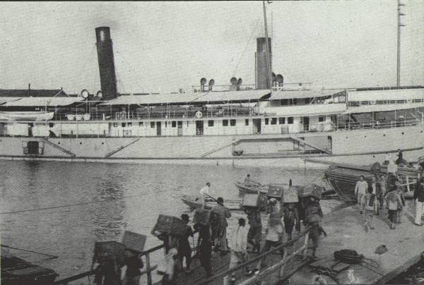 TEA FOR FOREIGN LANDS

Foreign steamers being loaded with native cargoes for export; scene on
the Hankow Bund. The tea trade of China has lost considerable ground in
recent years.