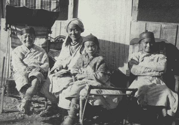 REFORMED HUA MIAO STUDENTS TAKING IT EASY

Picture shows how much they have benefitted under the missionary's
influence. Taken at the British mission compound in Tongch'uanfu.