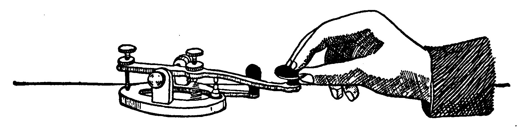 Fig. 141.—How to hold a Telegraph Key.